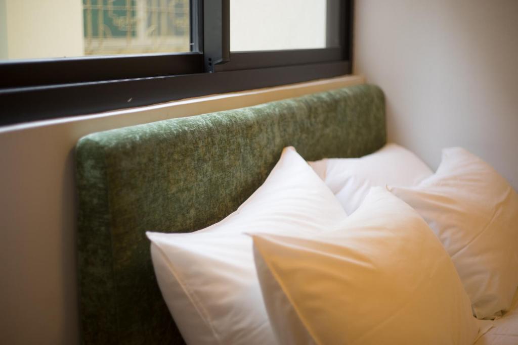 Postel nebo postele na pokoji v ubytování 未艾公寓WeLove Apartment
