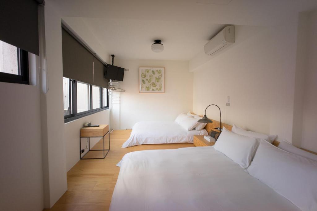 Postel nebo postele na pokoji v ubytování 未艾公寓WeLove Apartment