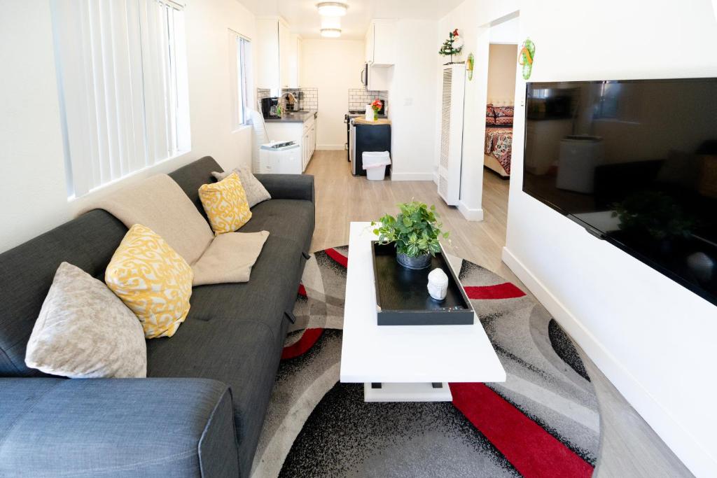 a living room with a couch and a table at cozy small 2 bedroom in Koreatown/Hollywood in Los Angeles