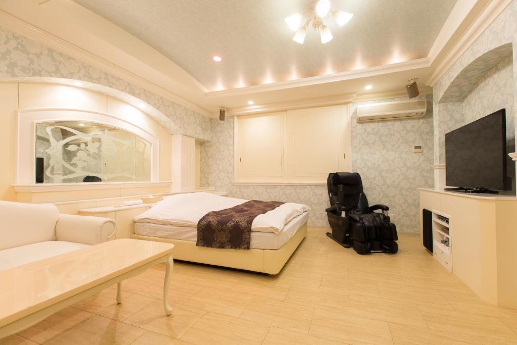 Televiisor ja/või meelelahutuskeskus majutusasutuses ホテルシエル沼津店 -大人専用-