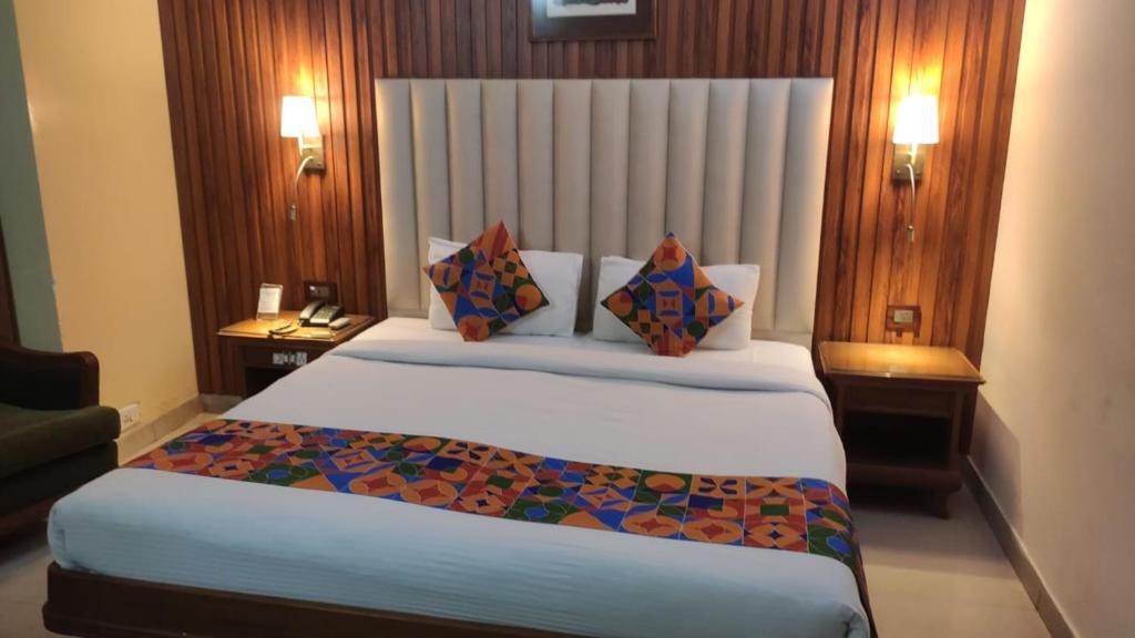 Postel nebo postele na pokoji v ubytování HOTEL CONCLAVE EXECUTIVE