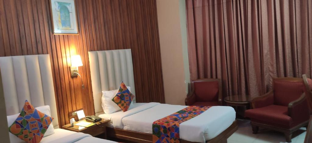 Postel nebo postele na pokoji v ubytování HOTEL CONCLAVE EXECUTIVE