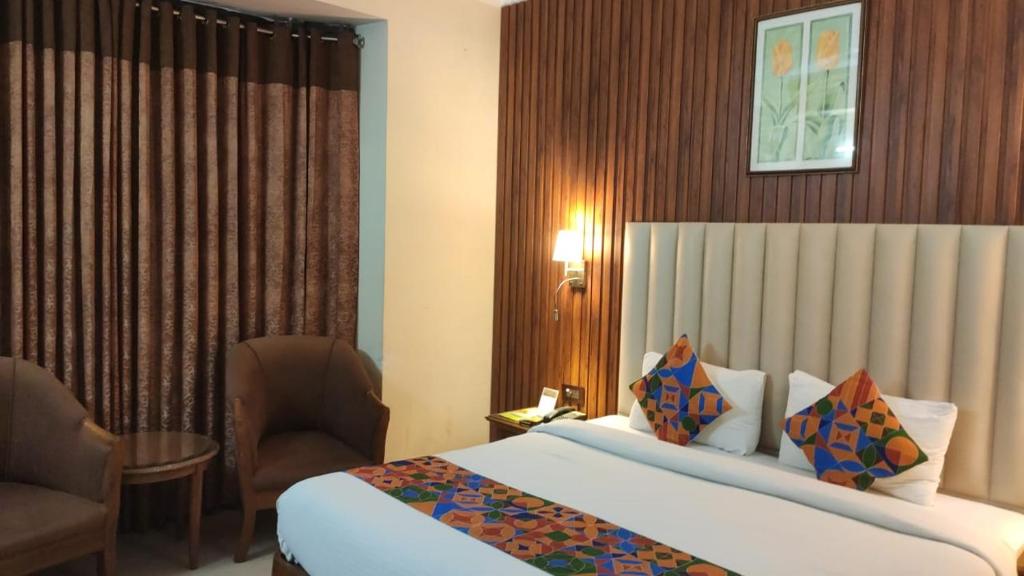 Postel nebo postele na pokoji v ubytování HOTEL CONCLAVE EXECUTIVE