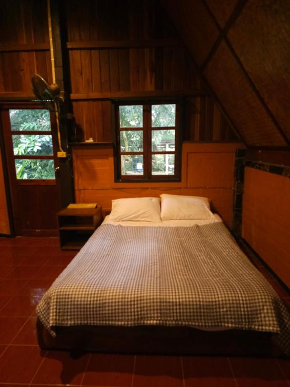 Postel nebo postele na pokoji v ubytování Pai Kiniman Resort