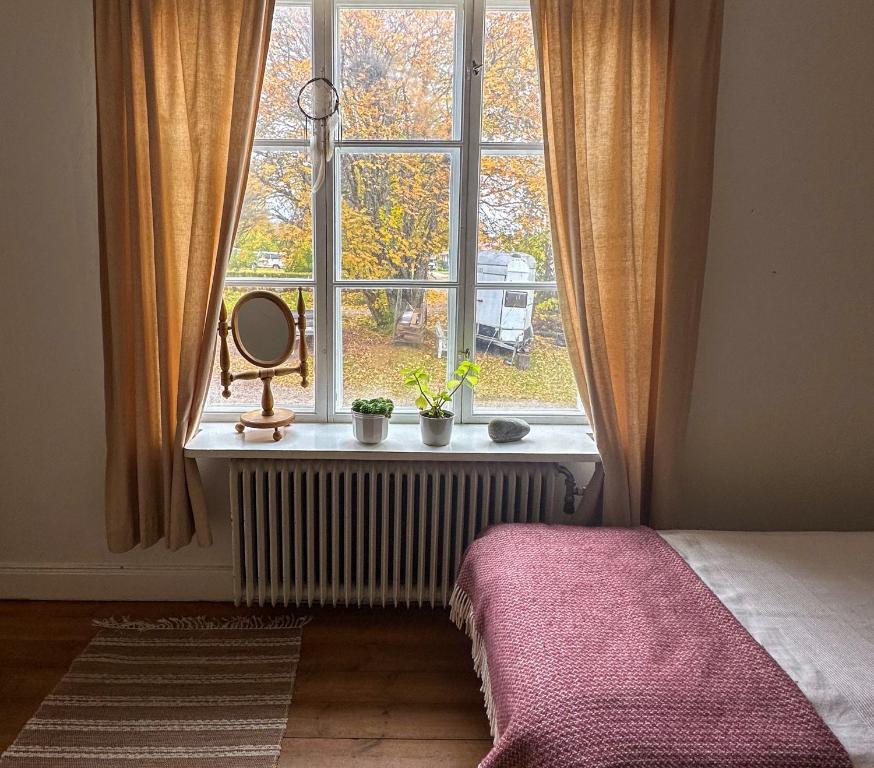 Postel nebo postele na pokoji v ubytování Fridhem Coursecenter & Guesthouse