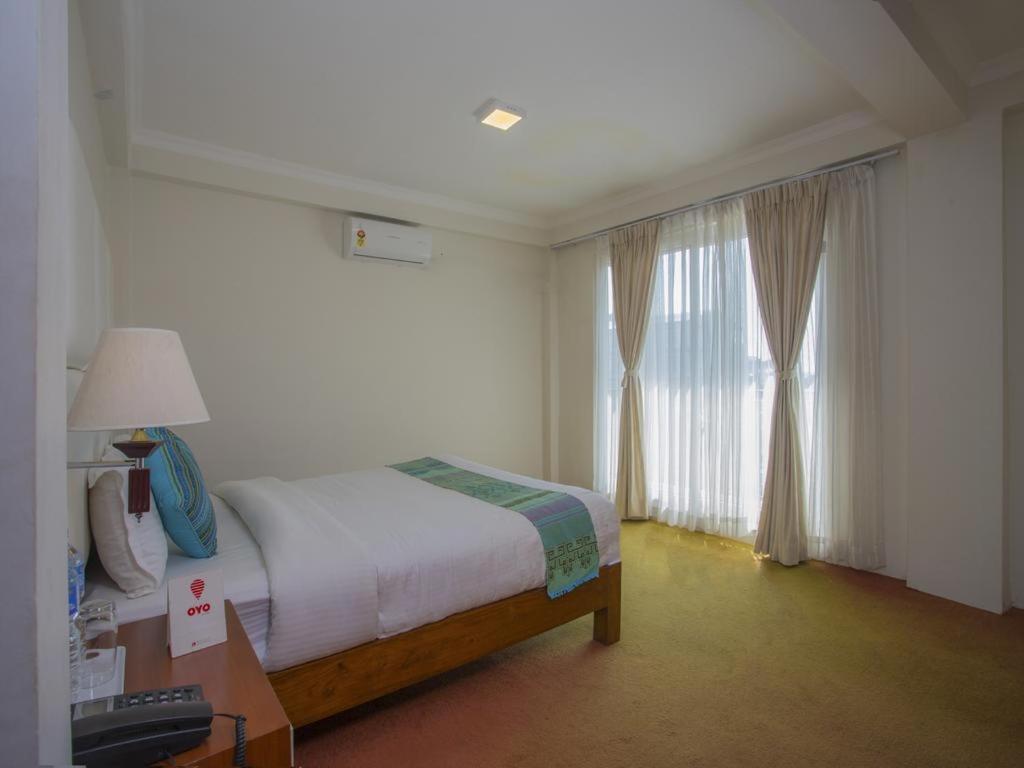 Postel nebo postele na pokoji v ubytování Hotel Bodhiz TUSAL