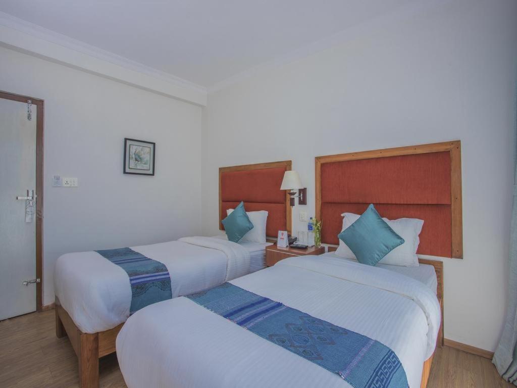 Postel nebo postele na pokoji v ubytování Hotel Bodhiz TUSAL