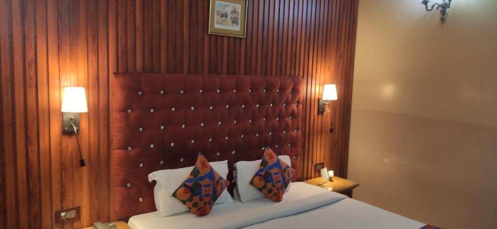 Postel nebo postele na pokoji v ubytování HOTEL CONCLAVE EXECUTIVE