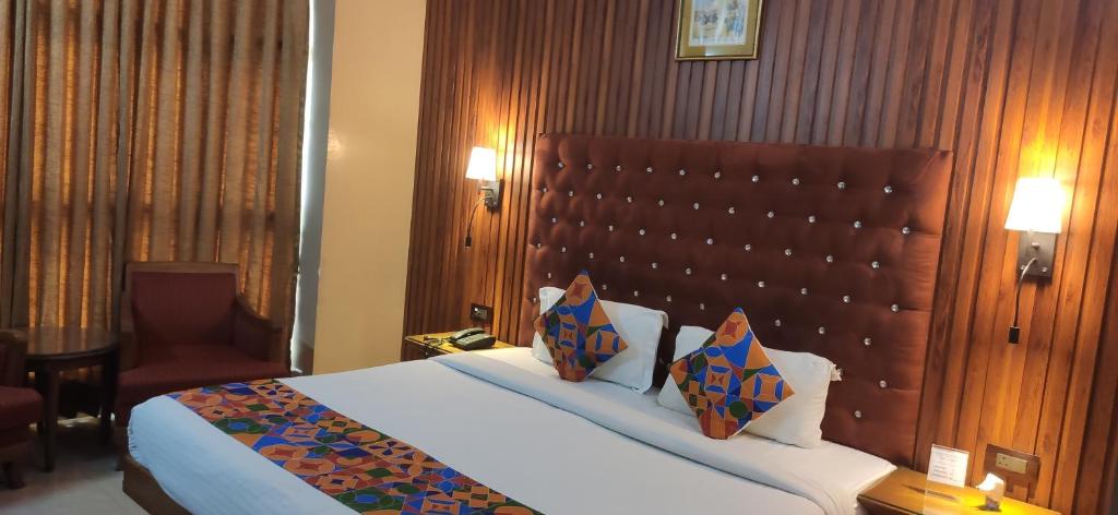 Postel nebo postele na pokoji v ubytování HOTEL CONCLAVE EXECUTIVE