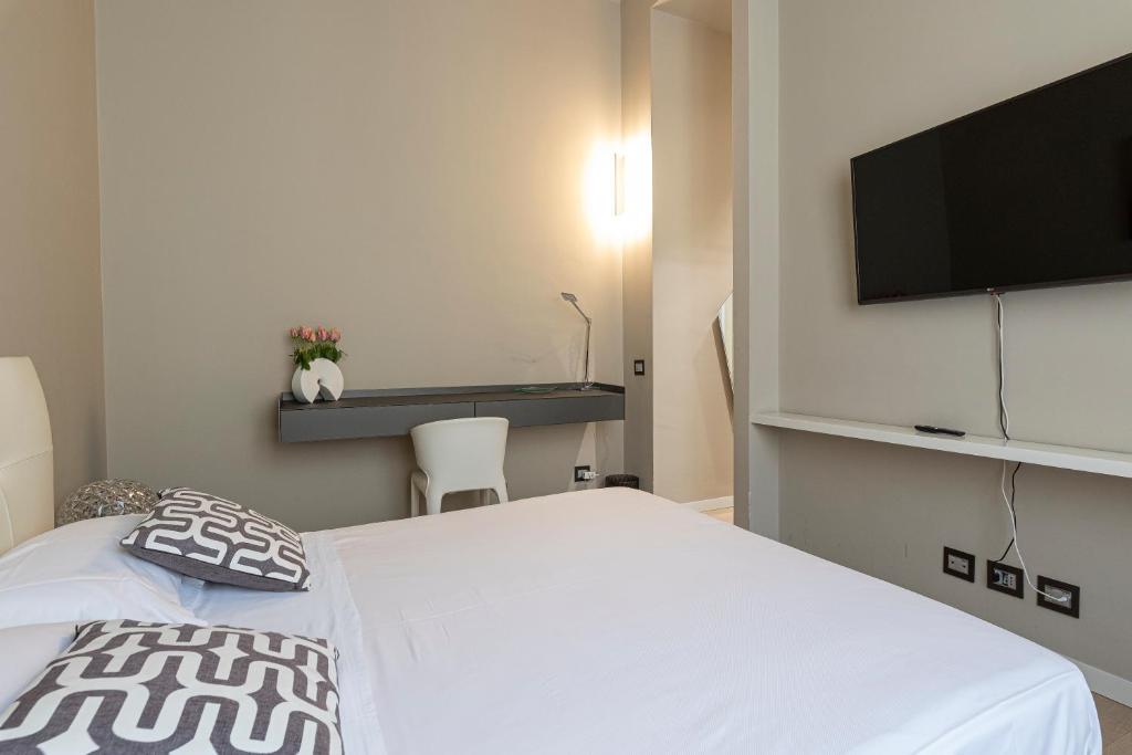 Televízia a/alebo spoločenská miestnosť v ubytovaní Deluxe apartment Milia Agrigento