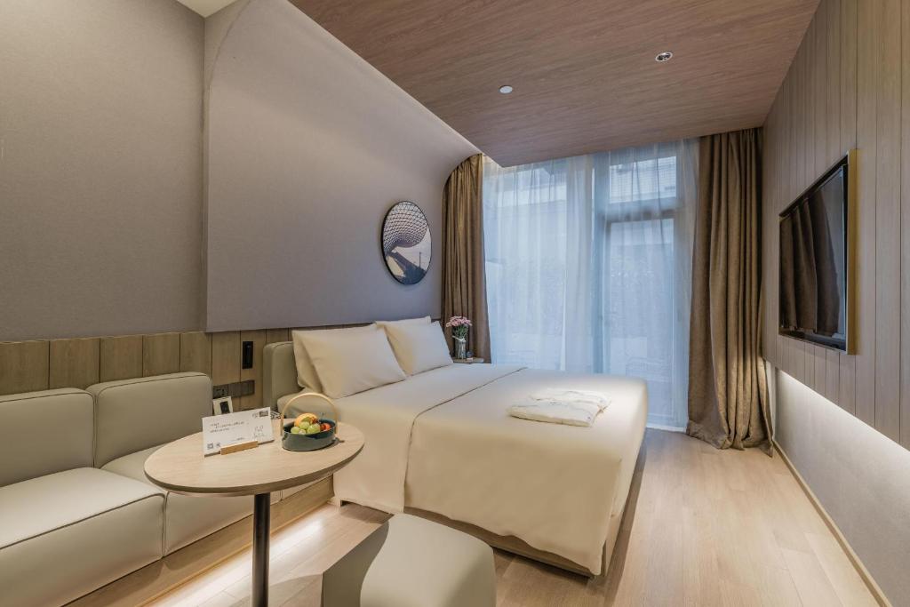 TV a/nebo společenská místnost v ubytování Atour Hotel Shanghai World Expo Center