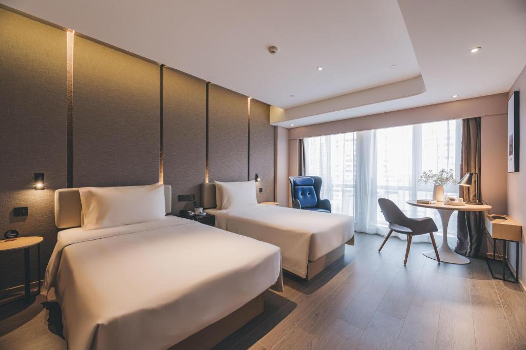 Postel nebo postele na pokoji v ubytování Atour S Hotel Shanghai Xujiahui Tianyaoqiao