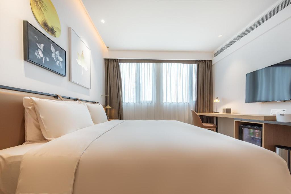 TV a/nebo společenská místnost v ubytování Atour Hotel Shenzhen Nanshan Vanke Yuncheng