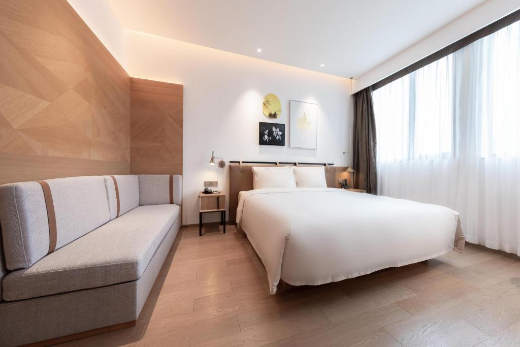 Postel nebo postele na pokoji v ubytování Atour Hotel Shenzhen Nanshan Vanke Yuncheng