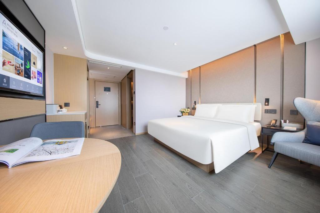 Postel nebo postele na pokoji v ubytování Atour Hotel Shanghai Xinzhuang CBD