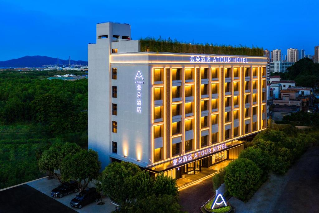 an aerial view of a hotel building at night at Atour Hotel Zhuhai High Tech Zone University Town Government Affairs Center in Zhuhai