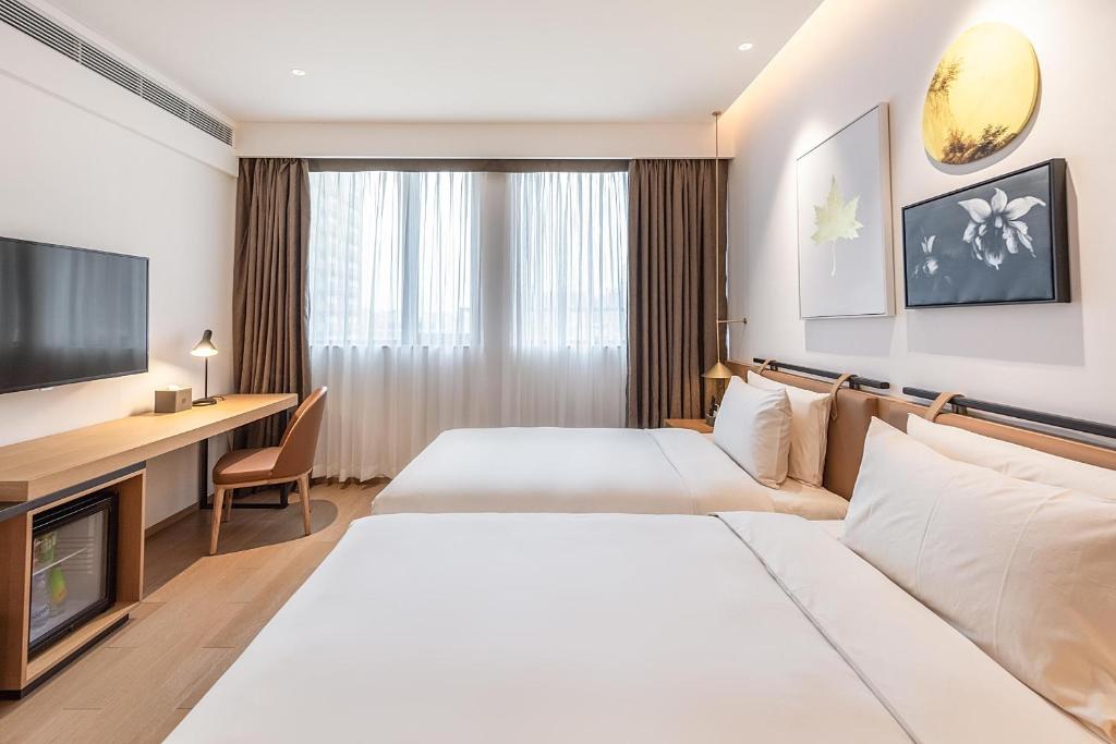 TV a/nebo společenská místnost v ubytování Atour Hotel Shenzhen Nanshan Vanke Yuncheng
