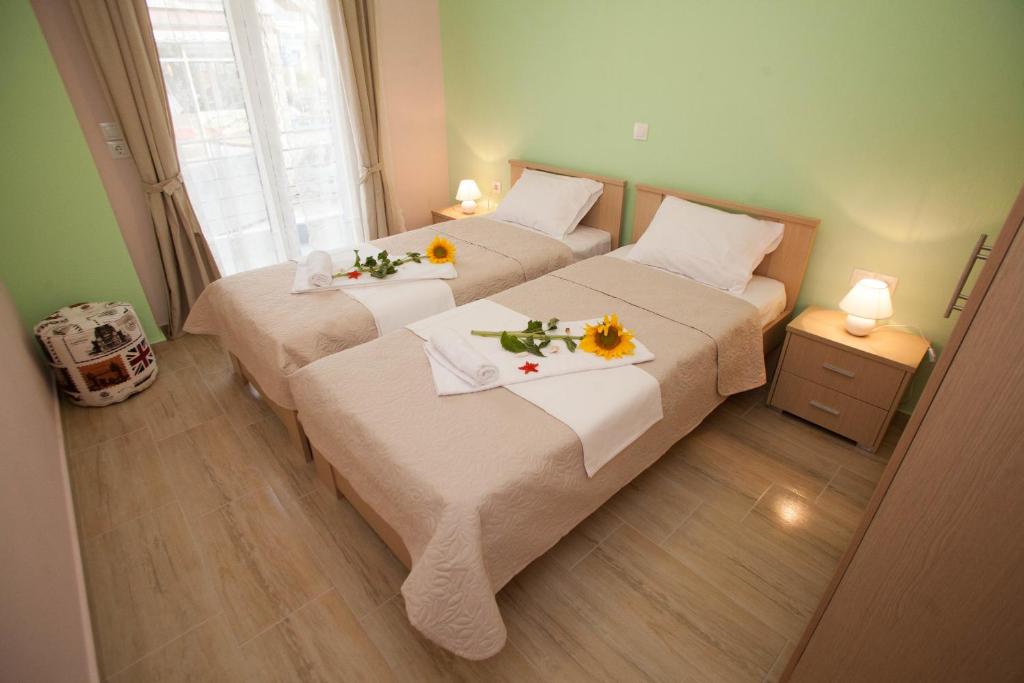 Postel nebo postele na pokoji v ubytování Kentrikon Suites
