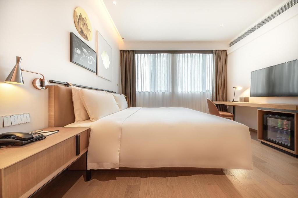 TV a/nebo společenská místnost v ubytování Atour Hotel Shenzhen Nanshan Vanke Yuncheng
