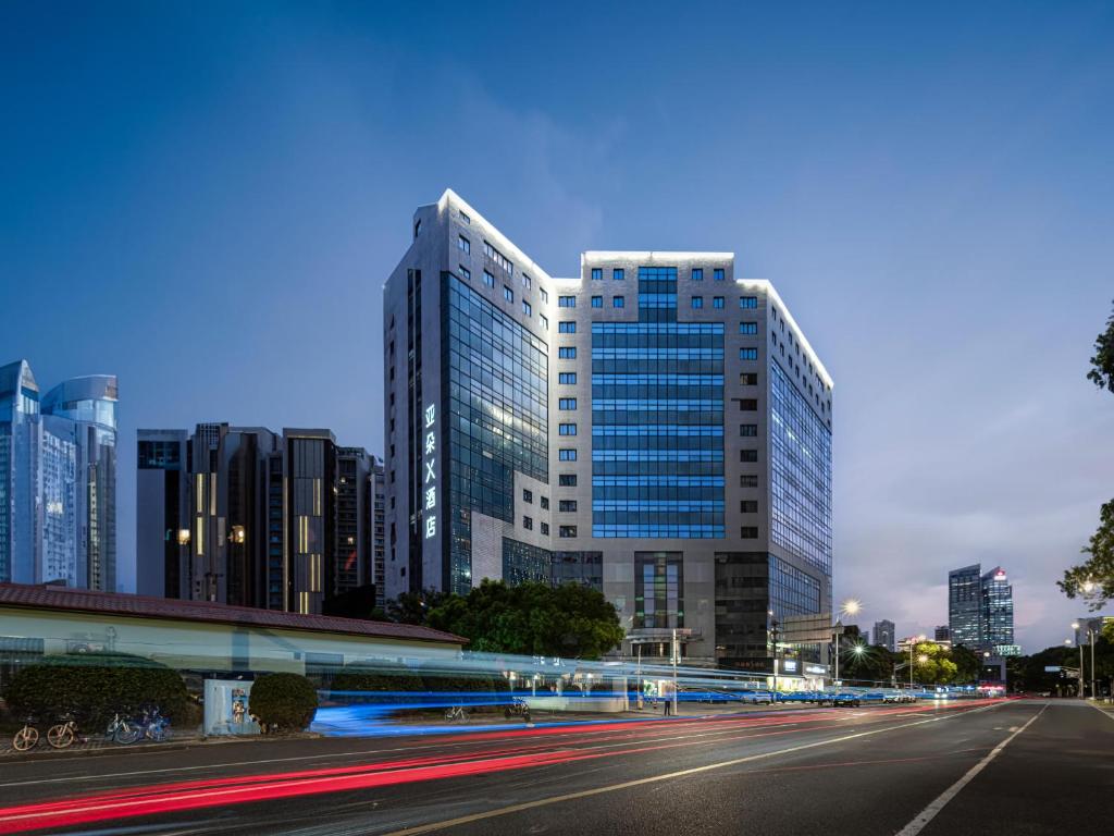 a city skyline with tall buildings and a street at Atour X Hotel Shanghai Lujiazui Binjiang Avenue in Shanghai