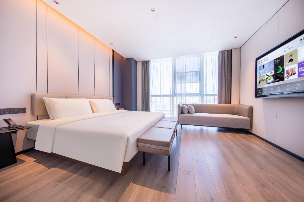 Postel nebo postele na pokoji v ubytování Atour Hotel Guangzhou Huangpu Development Zone Baoying