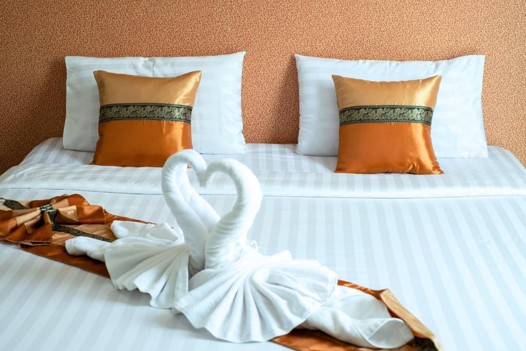 Postel nebo postele na pokoji v ubytování Km Hotel Chiang Mai