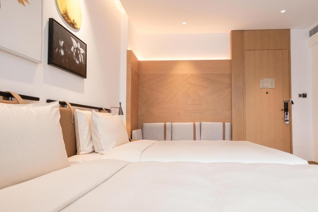 Postel nebo postele na pokoji v ubytování Atour Hotel Shenzhen Nanshan Vanke Yuncheng