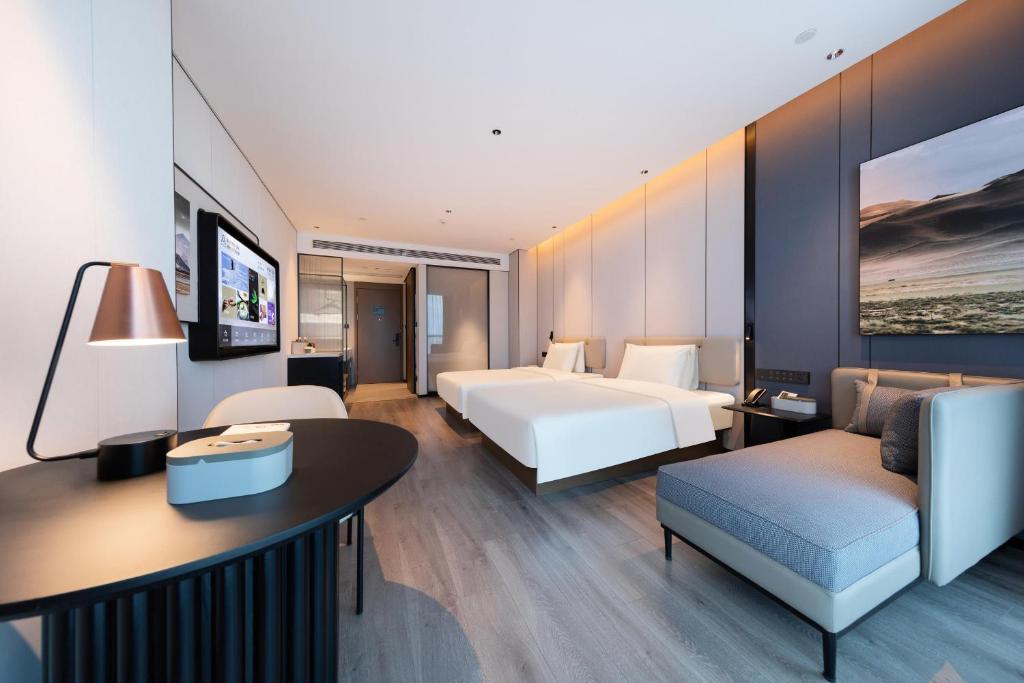 Postel nebo postele na pokoji v ubytování Atour Hotel Guangzhou Huangpu Development Zone Baoying