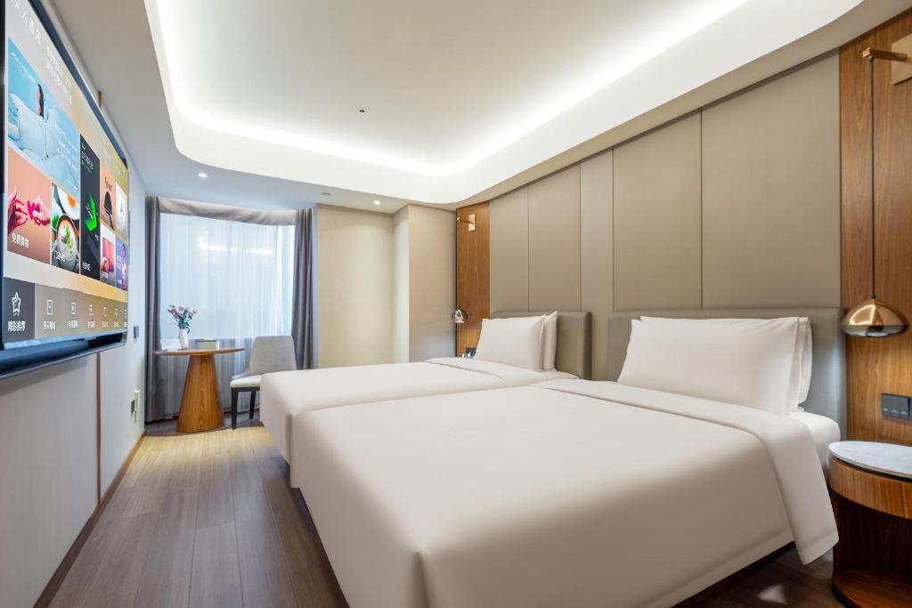 Postel nebo postele na pokoji v ubytování Atour X Hotel Shanghai Lujiazui Binjiang Avenue