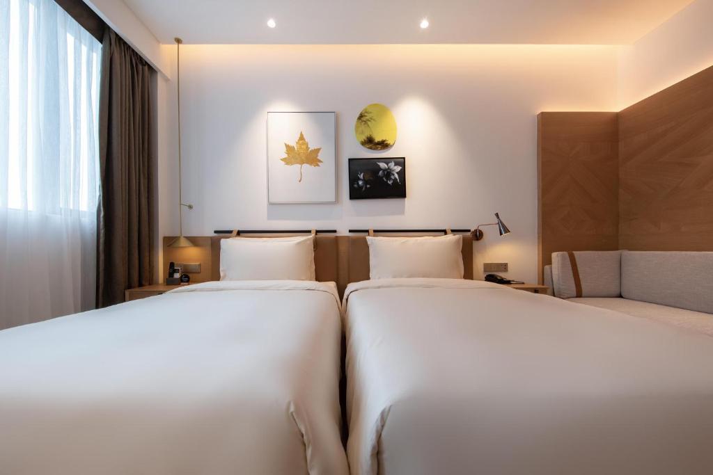 Postel nebo postele na pokoji v ubytování Atour Hotel Shenzhen Nanshan Vanke Yuncheng