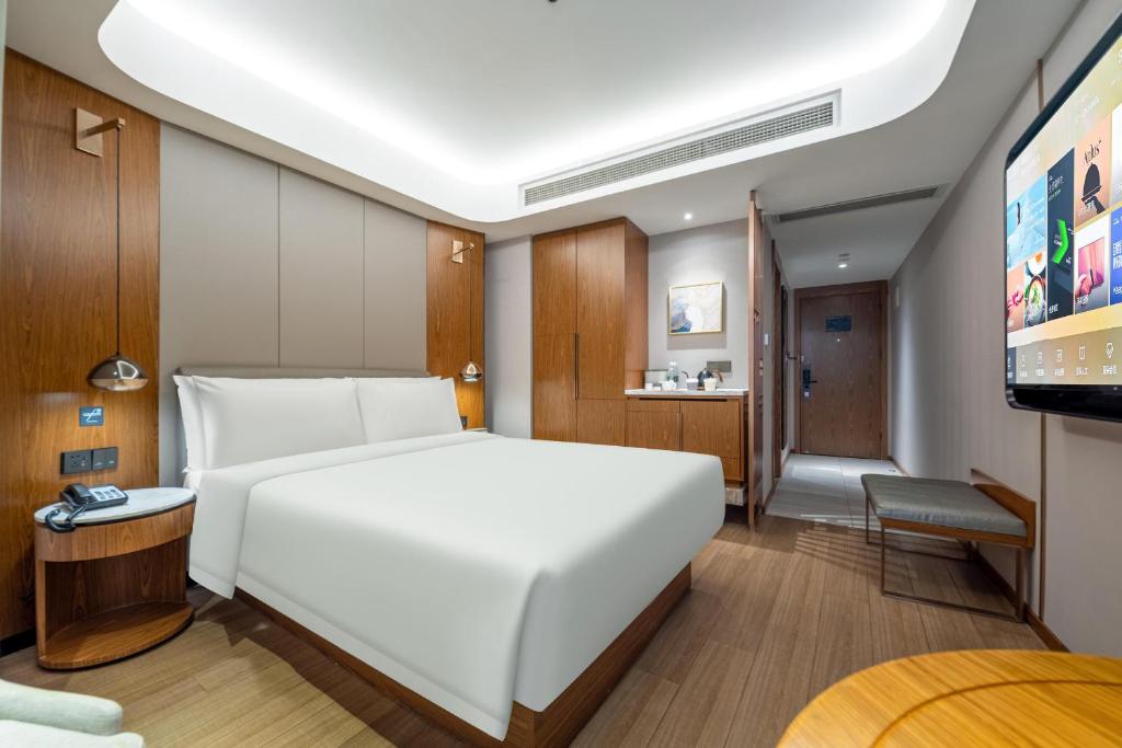 Postel nebo postele na pokoji v ubytování Atour X Hotel Shanghai Lujiazui Binjiang Avenue