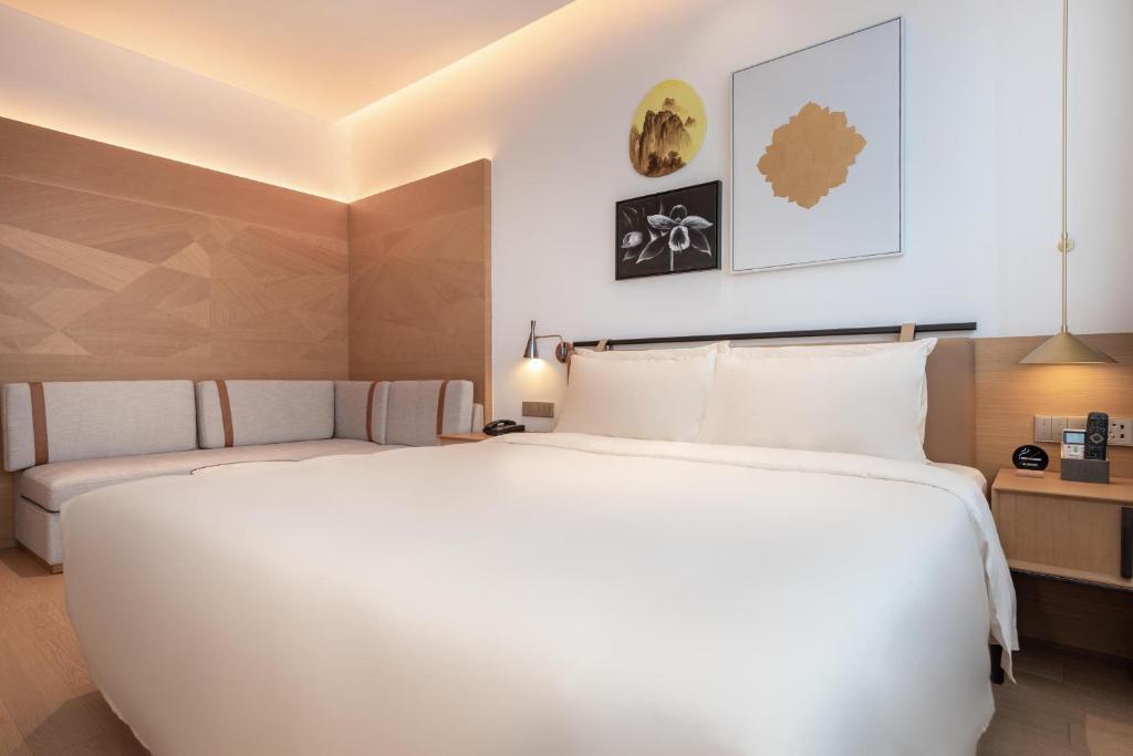 Postel nebo postele na pokoji v ubytování Atour Hotel Shenzhen Nanshan Vanke Yuncheng