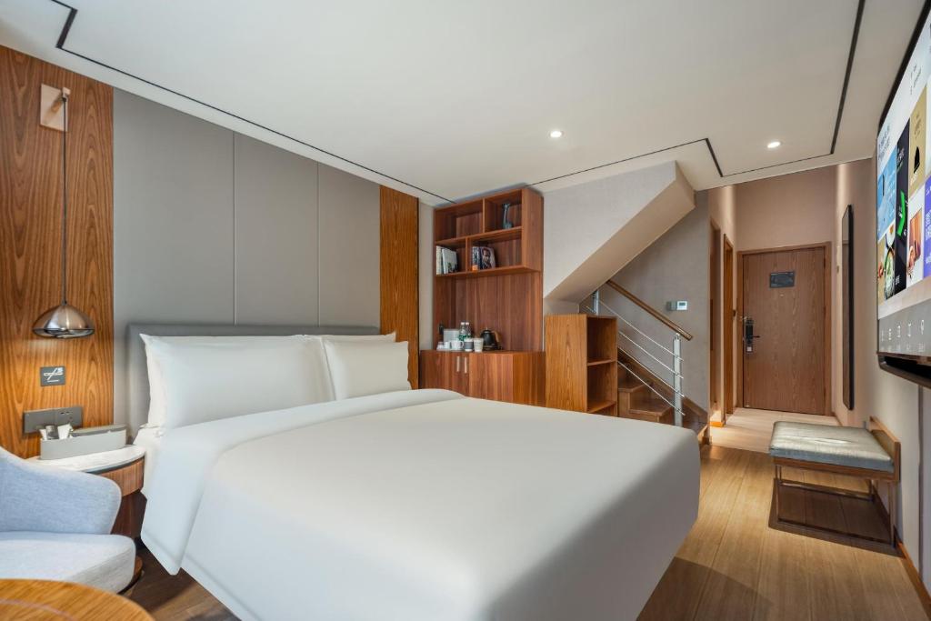 Postel nebo postele na pokoji v ubytování Atour X Hotel Shanghai Lujiazui Binjiang Avenue
