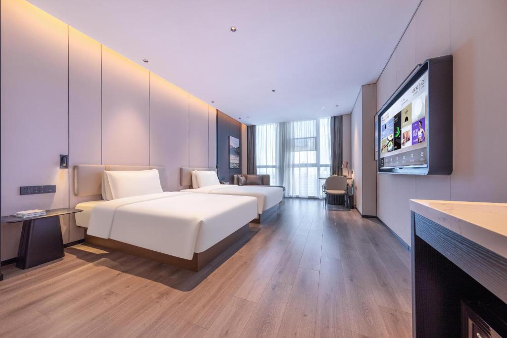 Postel nebo postele na pokoji v ubytování Atour Hotel Guangzhou Huangpu Development Zone Baoying