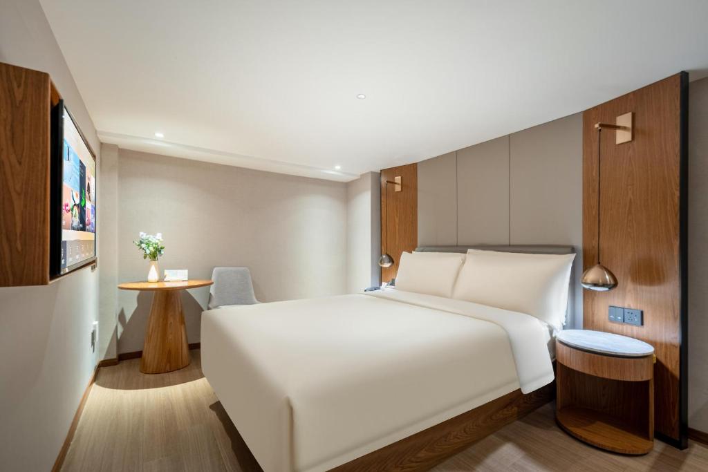 Postel nebo postele na pokoji v ubytování Atour X Hotel Shanghai Lujiazui Binjiang Avenue