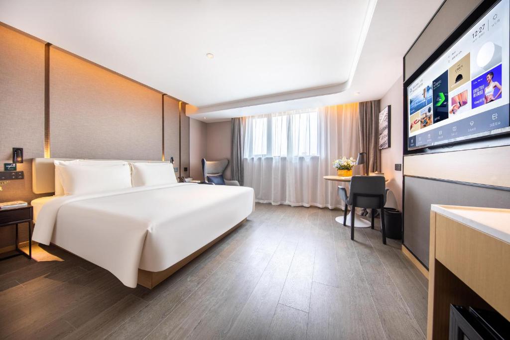 Postel nebo postele na pokoji v ubytování Atour Hotel Shanghai Xinzhuang CBD