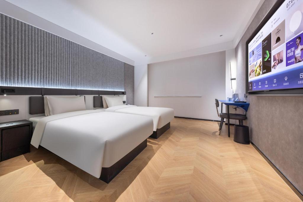 Postel nebo postele na pokoji v ubytování Atour Light Hotel Fuzhou Sanfang Qixiang