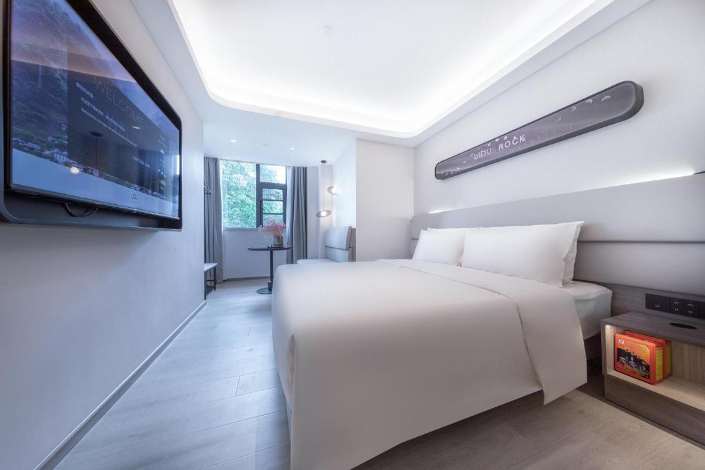 Postel nebo postele na pokoji v ubytování Atour Light Hotel Shanghai Pudong Zhangjiang Park Riverside
