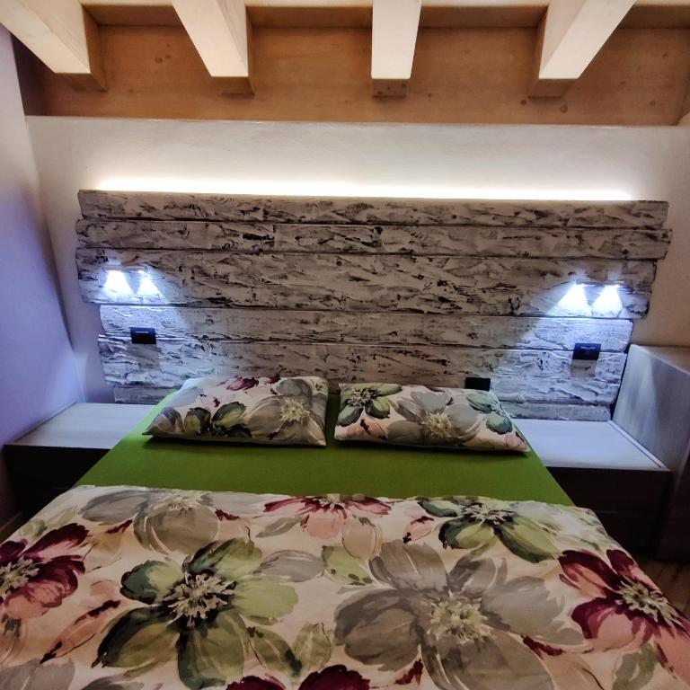 Postel nebo postele na pokoji v ubytování Al Dos