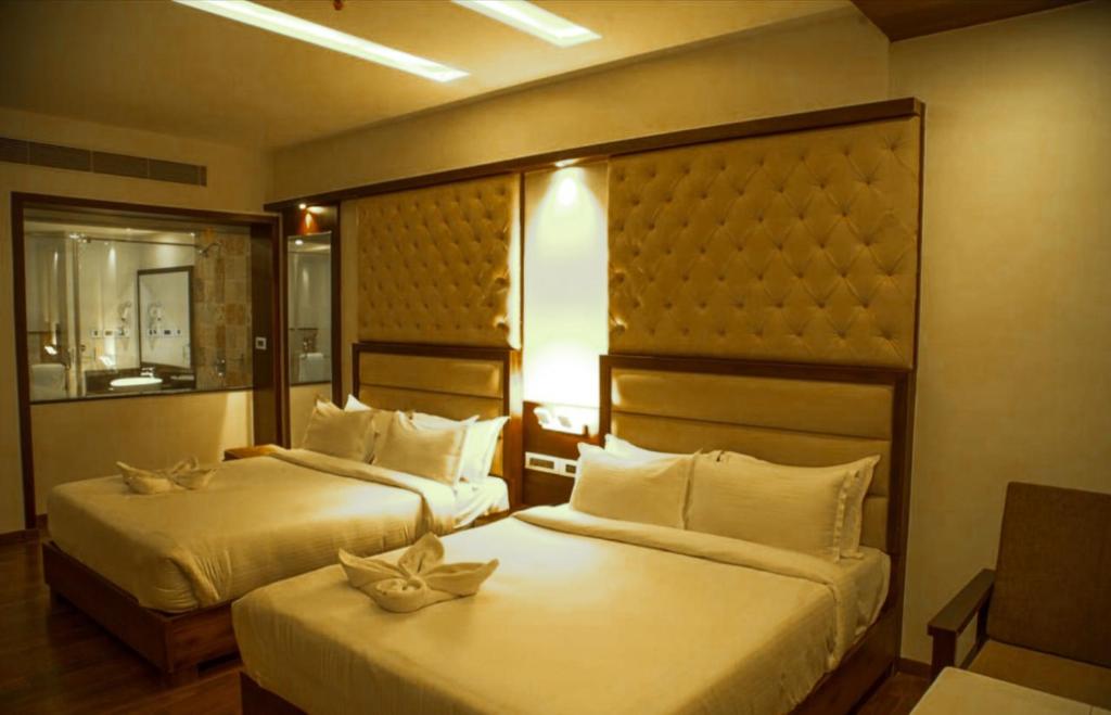 Postel nebo postele na pokoji v ubytování Hotel Preethi International
