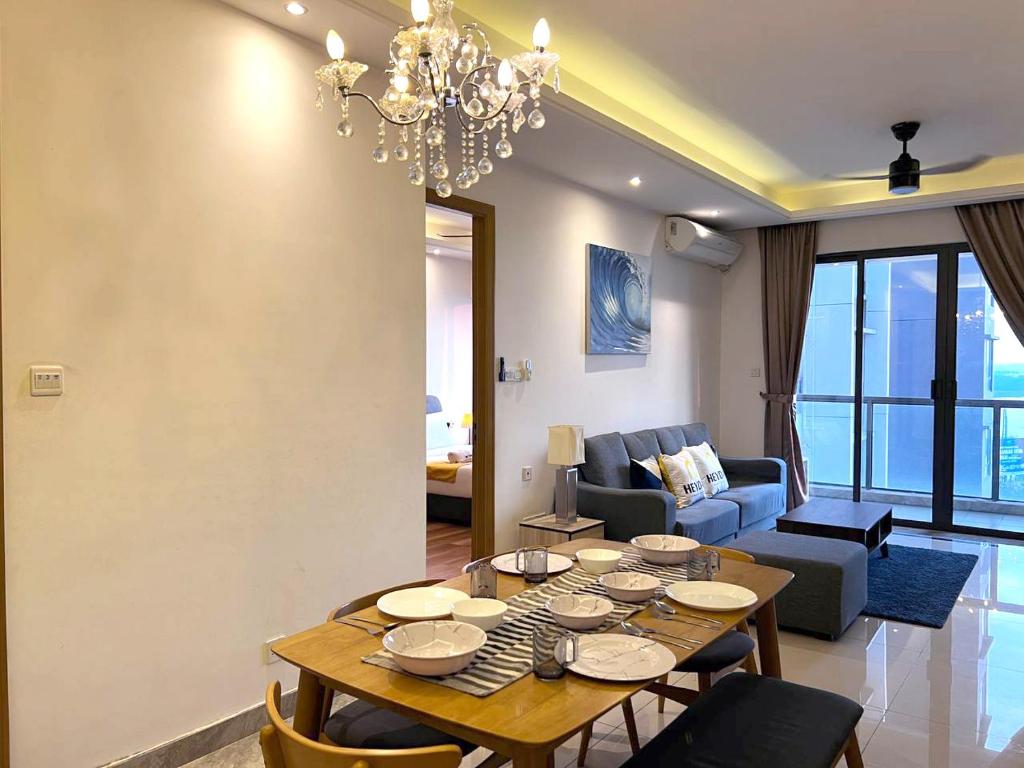 a living room with a table and a couch at R&F Princess Cove@2Bed2Bath in Johor Bahru