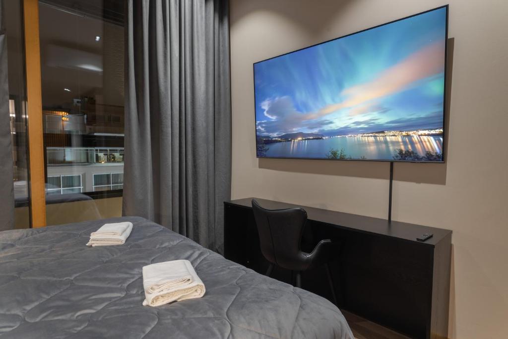 TV a/nebo společenská místnost v ubytování Royal Penthouse Apartment