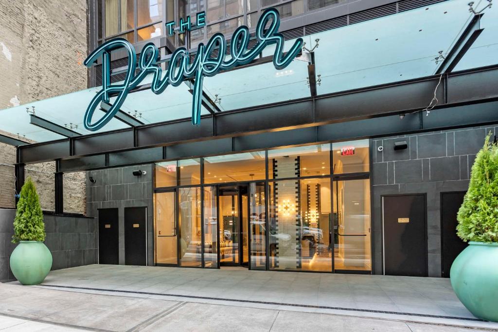 a store front of a building with a sign on it at The Draper New York, Tapestry Collection by Hilton in New York