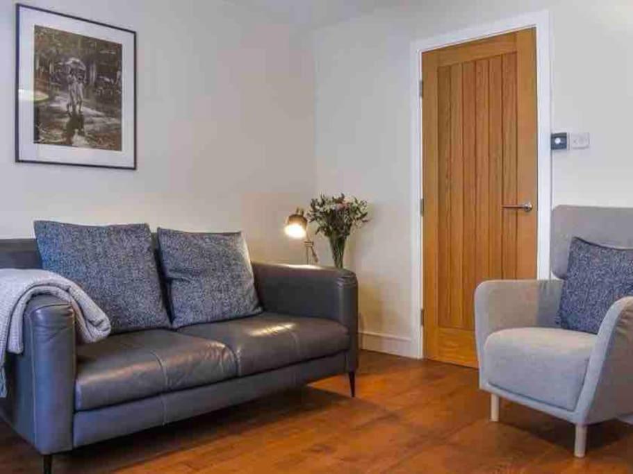 a living room with a couch and a chair at No. 3 A cosy spot for 4 in Cawood