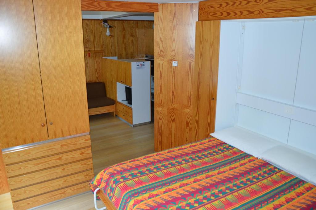 Postel nebo postele na pokoji v ubytování Appartamenti Vacanze Casa -Residence Albare - check in Vacanze Casa - Marilleva 900