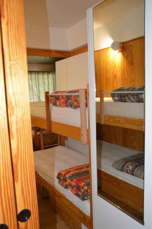 Postel nebo postele na pokoji v ubytování Appartamenti Vacanze Casa -Residence Albare - check in Vacanze Casa - Marilleva 900