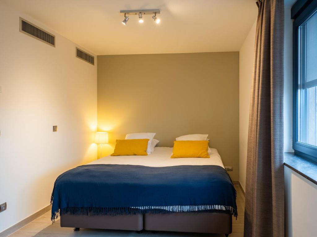 Postel nebo postele na pokoji v ubytování Tower Hotel Aalst