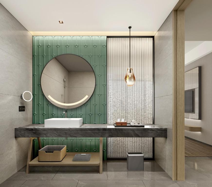 a bathroom with a sink and a mirror at Holiday Inn Chengdu East, an IHG Hotel in Chengdu