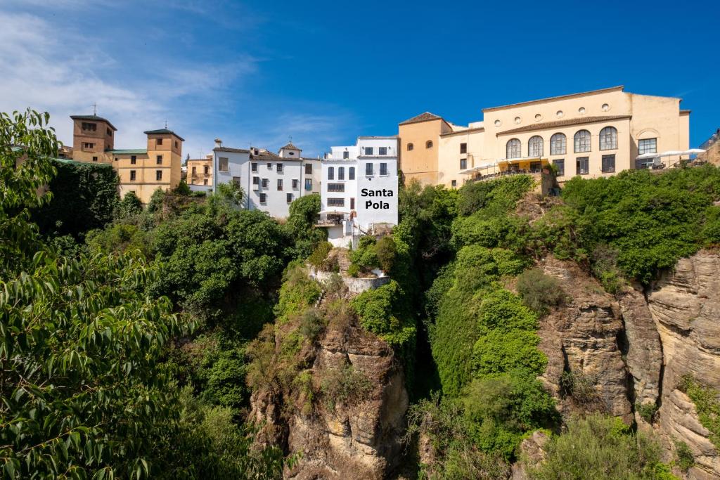a group of buildings on the side of a mountain at Apartamentos Casa-Palacio Santa Pola in Ronda