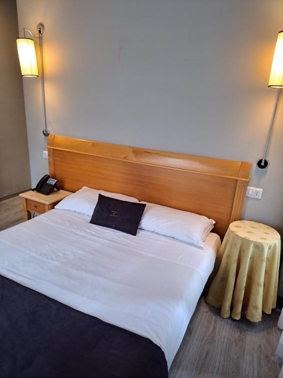 Postel nebo postele na pokoji v ubytování Hotel dei Quiriti